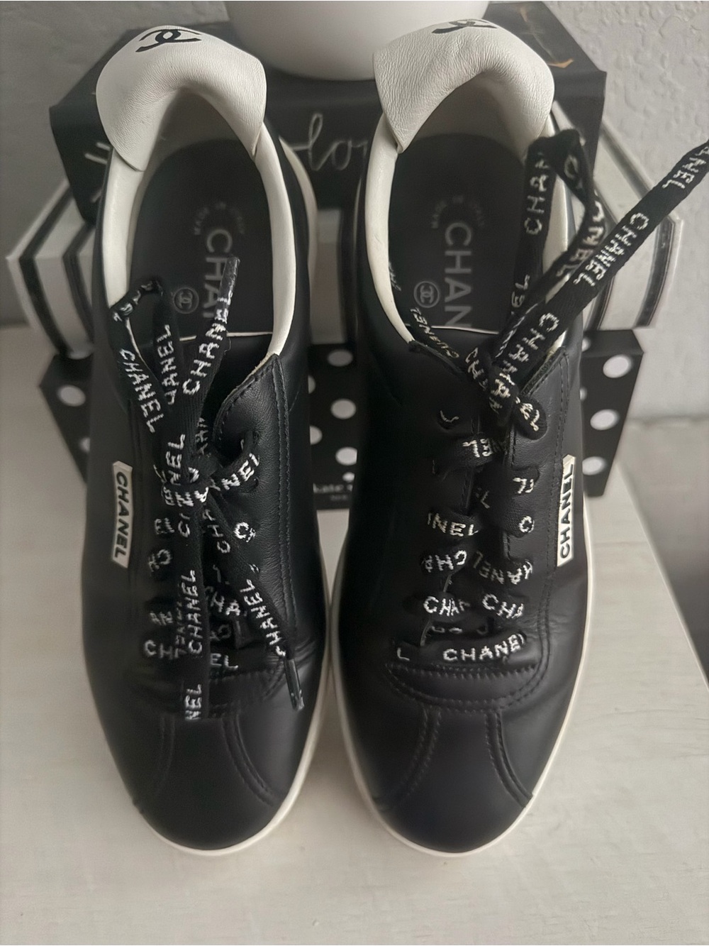 CHANEL Black Leather Logo Plaque Sneakers